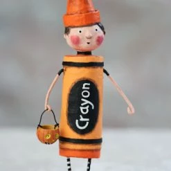 Lori Mitchell Orange Crayon Figurine